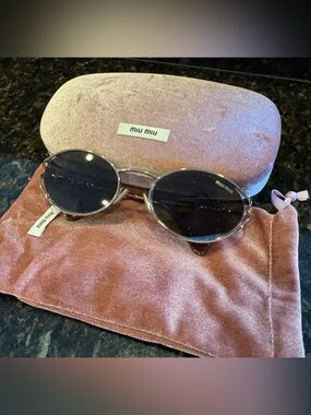 Miu Miu oval brown sunglasses